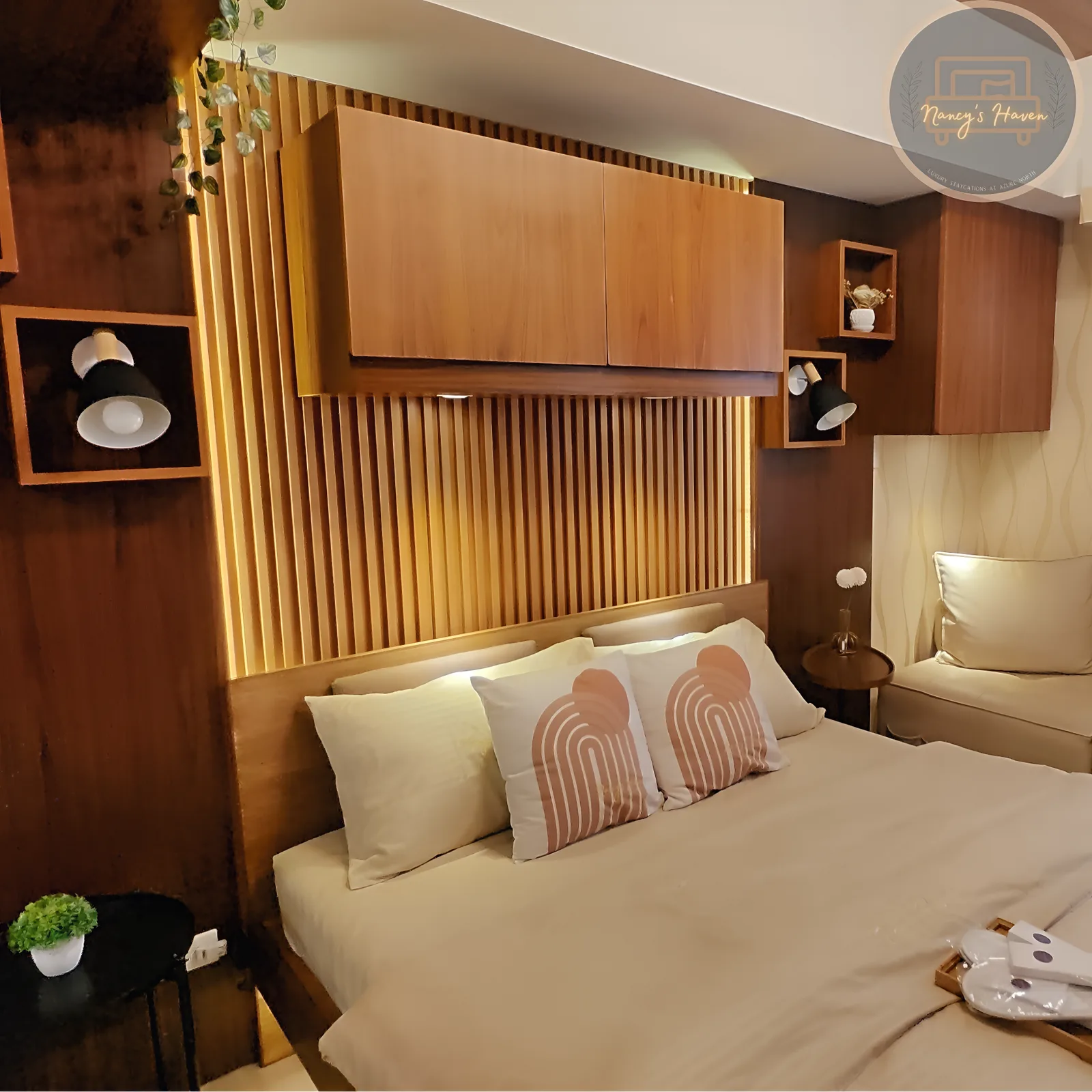 The bedroom at Nancy's Haven — a queen floating bed with warm LED slat headboard
